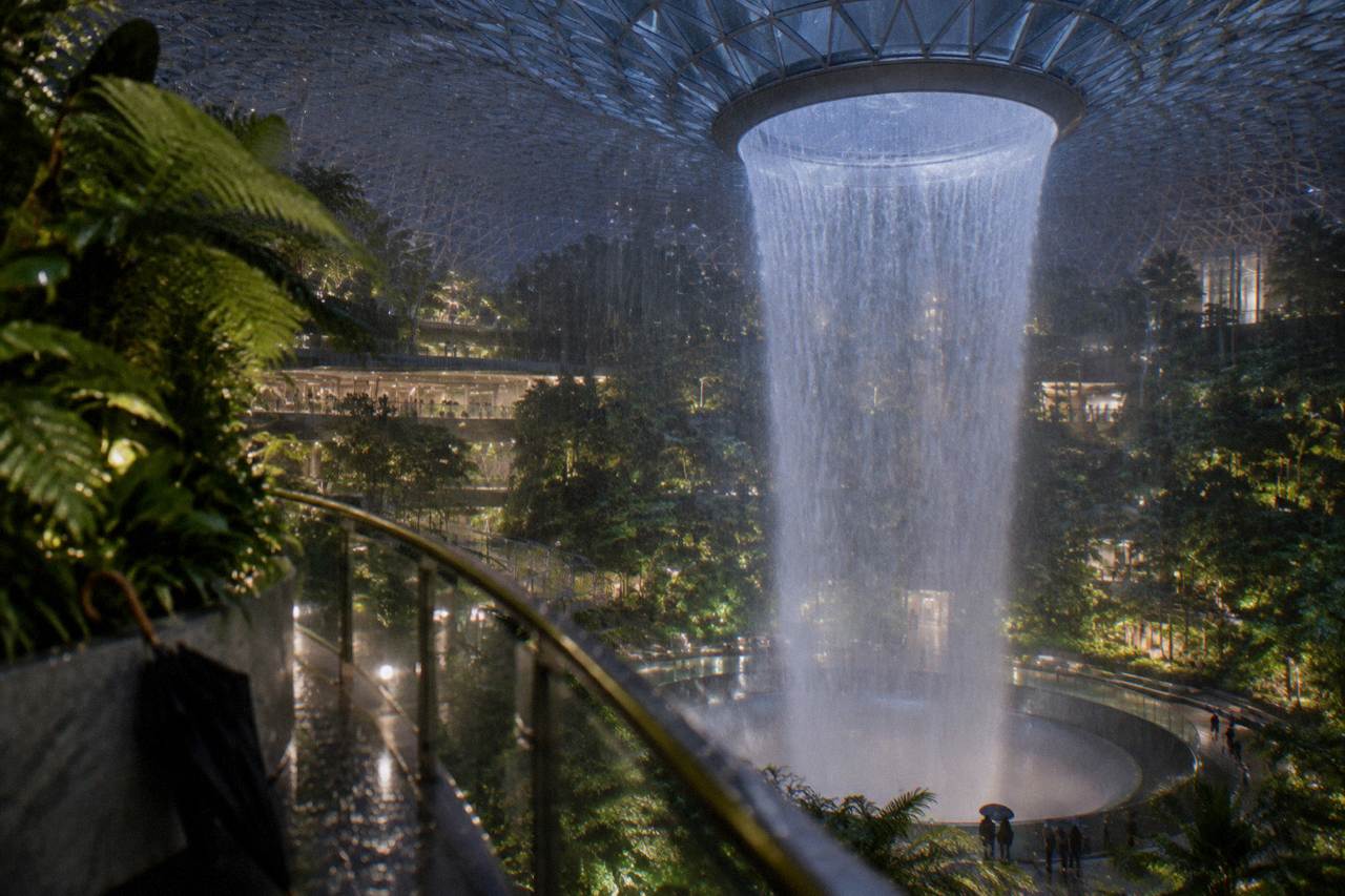 Interior of Jewel Changi with a tall waterfall falling through the centre of the building