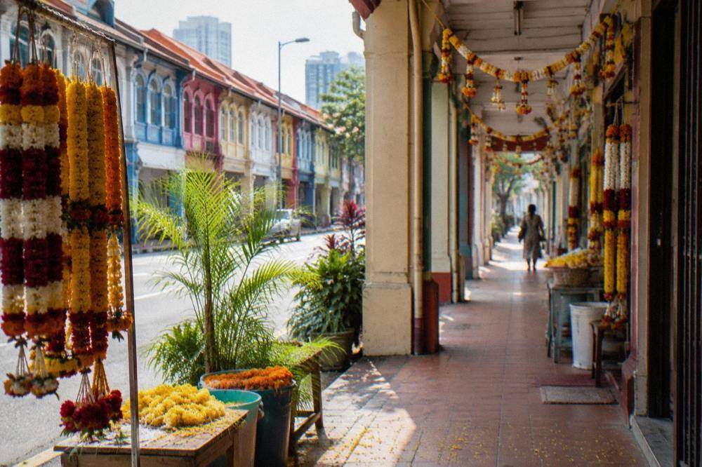 Colourful shophouses and market stalls on a street in Little India