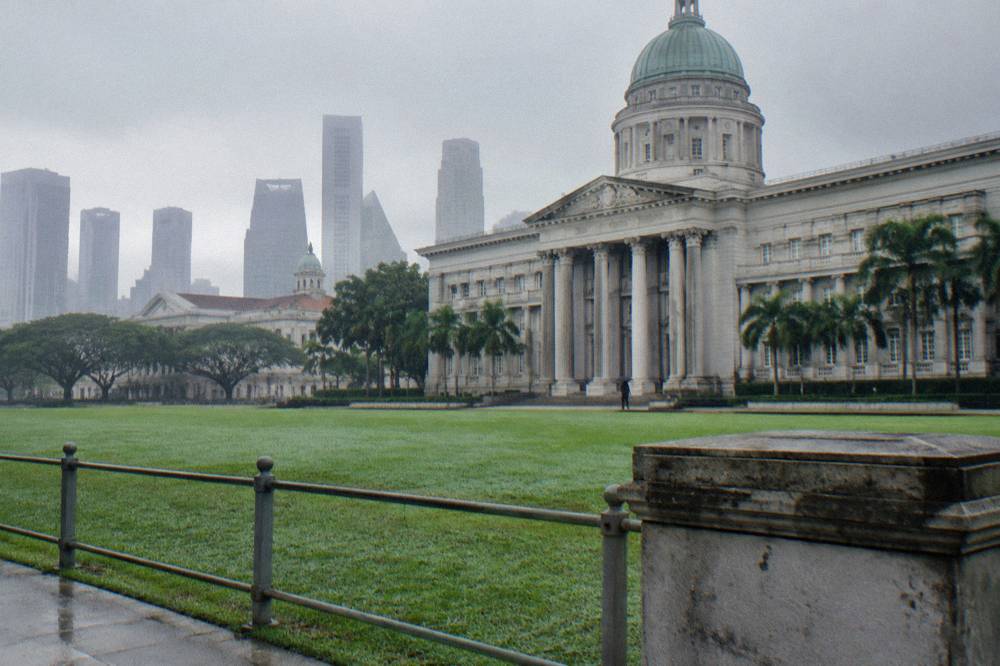 Classical museum facade with columns beside a city square