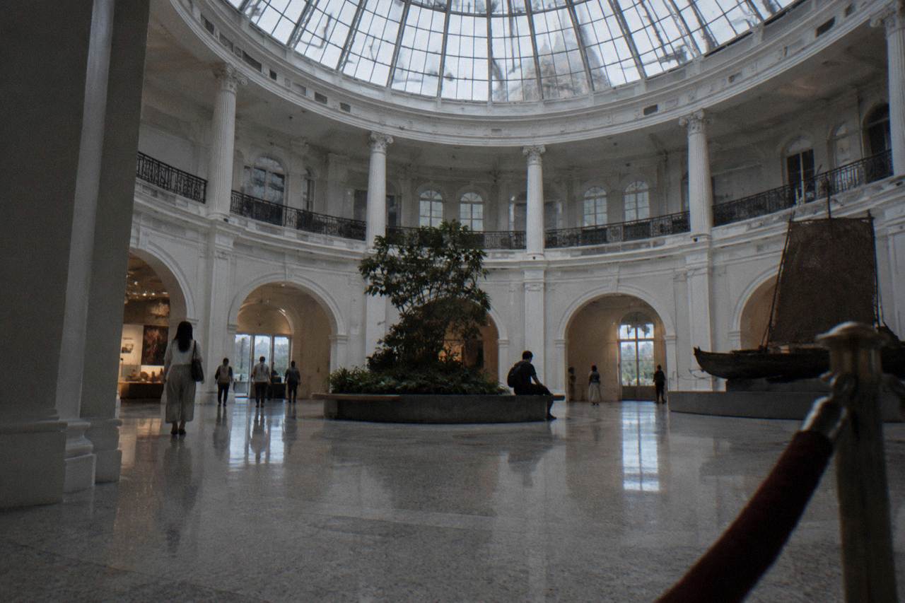 Museum gallery hall with tall columns and open space