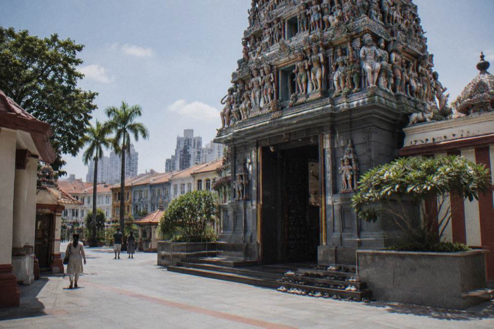 Ornate temple entrance tower decorated with colourful carved figures