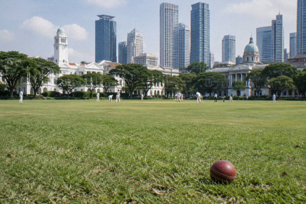 Colonial-era buildings and open ground in the Civic District under a clear sky